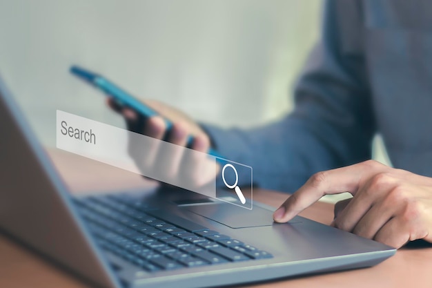 man searching laptop smartphone web search 539854 3980.jpg